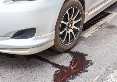 Water leaking from car radiator problem on the road clipart