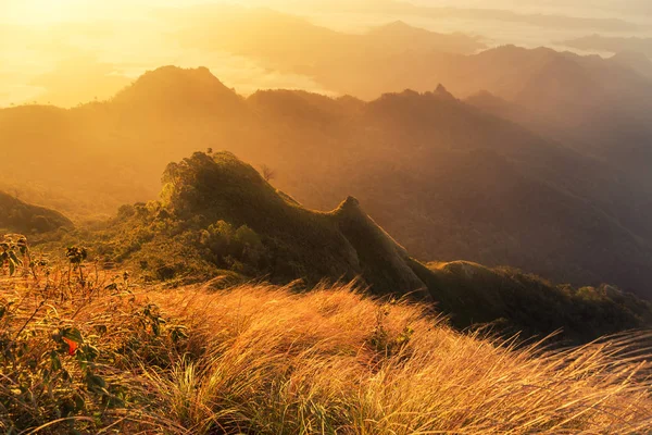 sunrise with fog covered layers mountain hills in early morning from view point of Phu Chi Dao or Phu Chee Dao mountain at Chiang Rai, Thailand