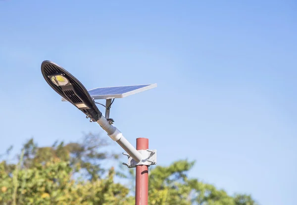 solar power street light in public park turn up skyward absorb the sunlight from the sun use light energy to generate electricity alternative renewable energy from the sun