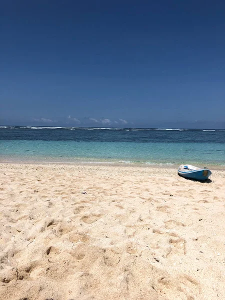 View of tropical beach with  blue boat — Stock Photo, Image