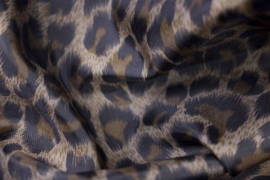 arka plan olarak leopar desenli kumaş görünümünü kapat