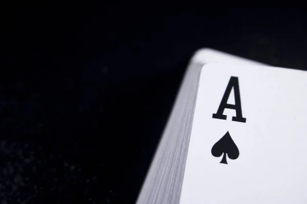 ace poker card stack deck on dark black background