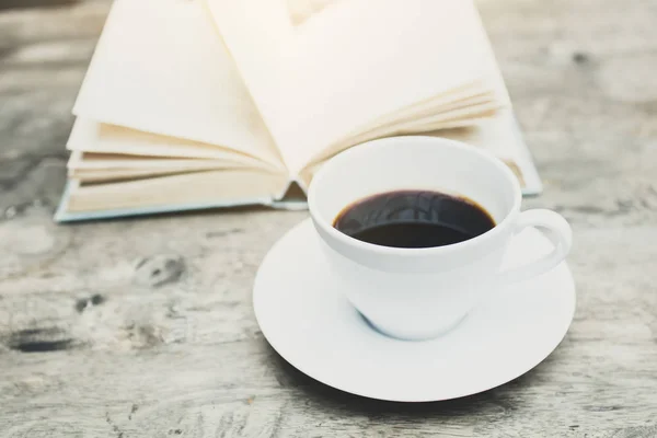 coffee and book on table in cafe