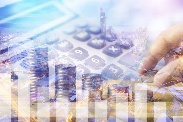 Finance and capital investment business concept, double exposure hand stacked money coins with calculator and night city