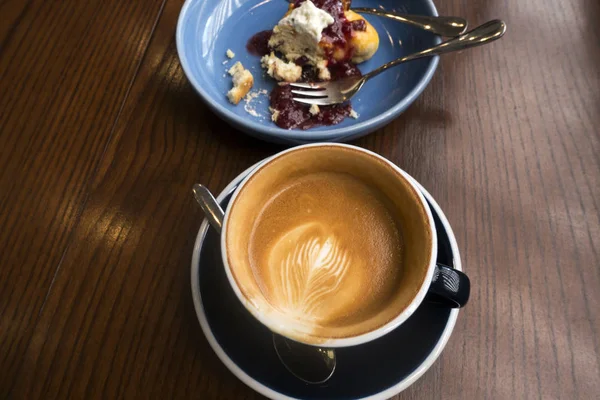 Hot coffee with Berry scone