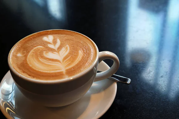 Latte coffee on stone table