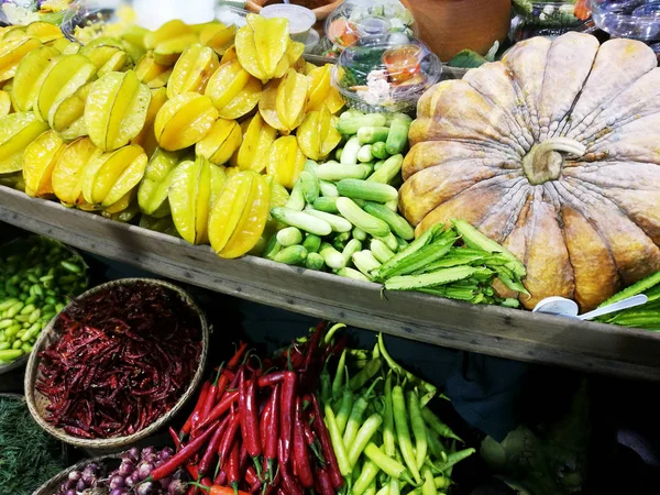 Various vegetables and fruits on a counter at street market