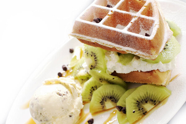 Sweet kiwi waffles with ice cream.