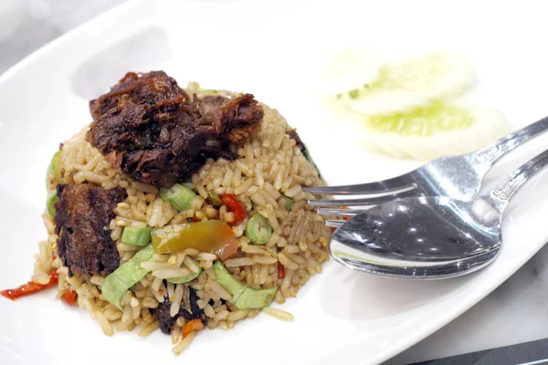 Basil fried rice with crispy pork.