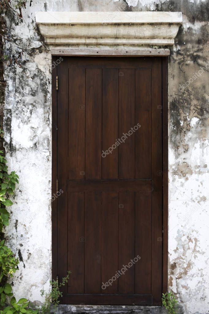 Old wooden doors on the walls of the old house