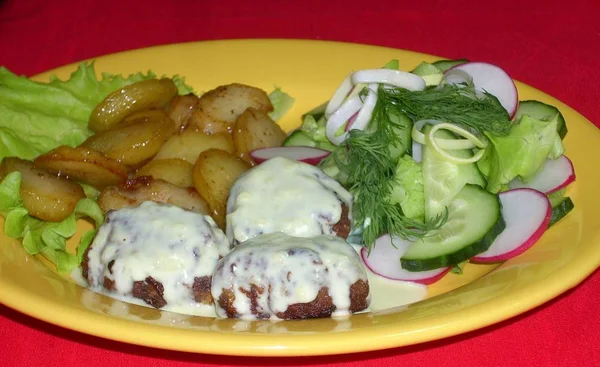 hot meal with potatoes and meatballs