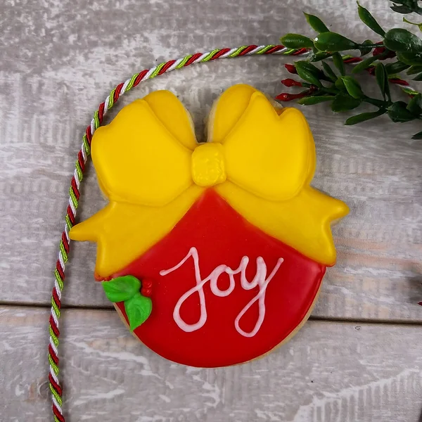 Closeup of joy sugar cookie with bow for christmas — ストック写真