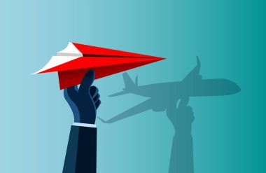 kırmızı kağıt uçak yakaladı el insan bir uçak gibi duvarda bir gölge var.