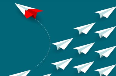 Kırmızı kağıt uçak beyazdan yön değiştiriyor. yeni bir fikir. 