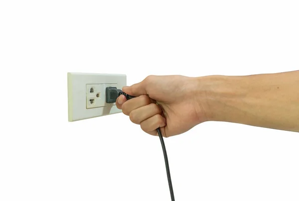 Hand hält elektrischen Stecker in die Steckdose isoliert f — Stockfoto