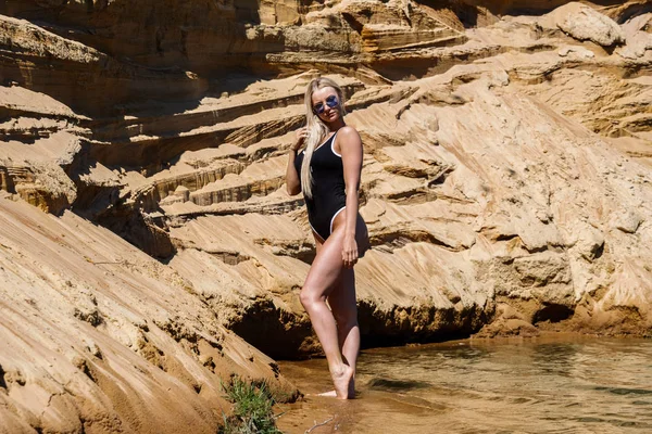 Outdoor Shot Beautiful Blond Woman Wearing Black Swimsuit Standing Beach — Stock Photo, Image