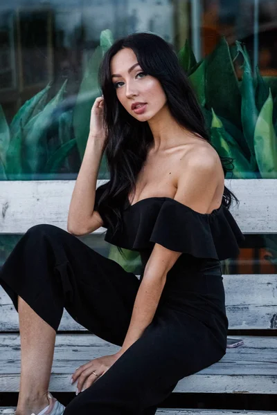 Portrait Beautiful Young Brunette Woman Black Dress Stylish Makeup Sitting — Stock Photo, Image