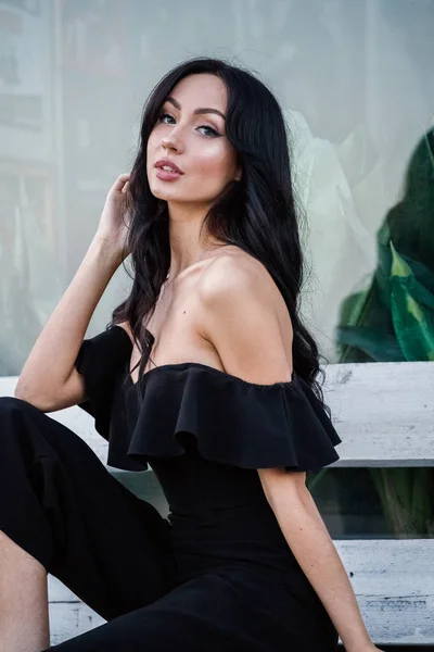 Portrait Beautiful Young Brunette Woman Black Dress Stylish Makeup Sitting — Stock Photo, Image