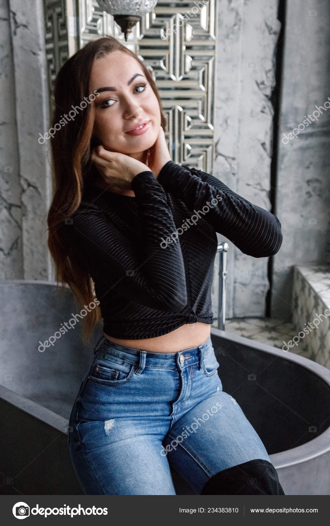 black blouse and blue jeans
