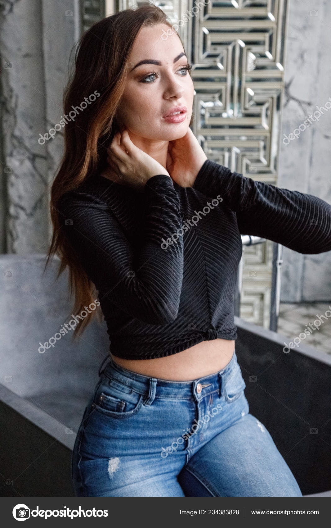 black blouse and blue jeans
