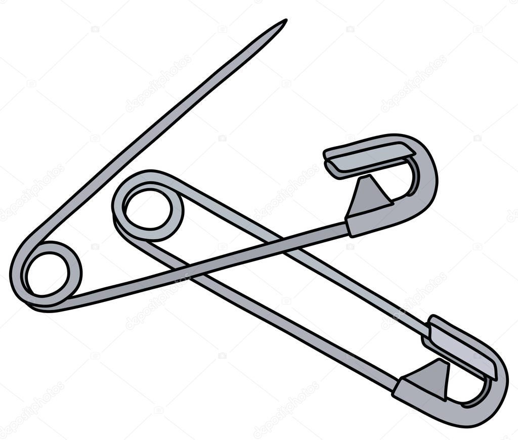 The vectorized hand drawing of two classic steel safety pins