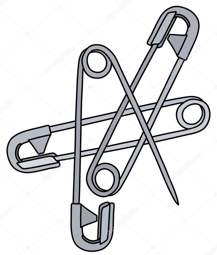 The vectorized hand drawing of three classic steel safety pins