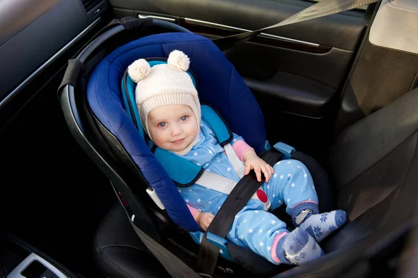 Baby sitting in a car seat, top view — Stock Photo, Image