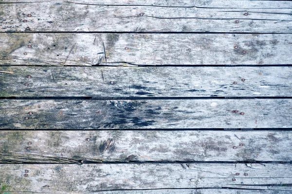 Texture of gray wooden pallet with signs of aging, fragment of a wooden fence — Stock Photo, Image