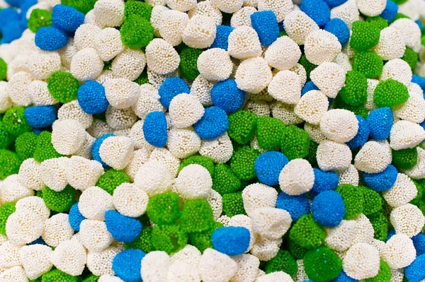 Tekstur warna putih, biru dan hijau sari manisan dalam bubuk manis, top view — Stok Foto