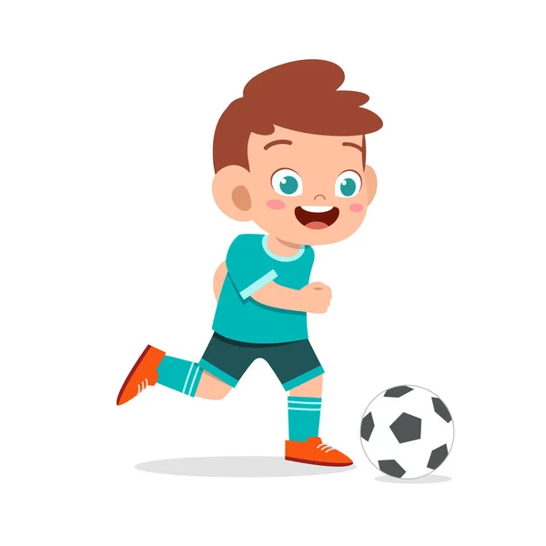 Słodkie dziecko chłopiec grać w piłkę nożną jako napastnik — Wektor stockowy