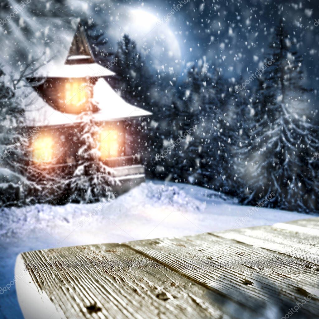 Snowy winter night background. Blurred freezing winter view.