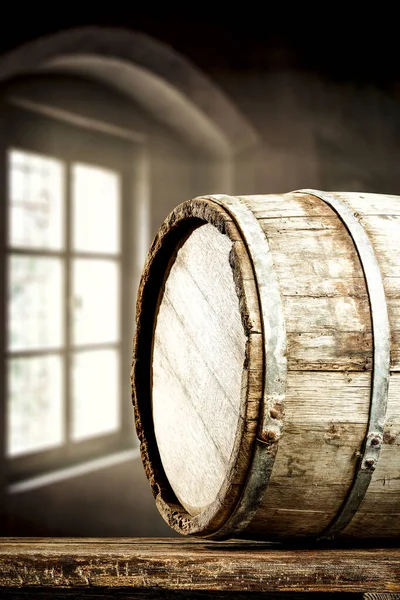 Wooden barrel with table top and windowl background. Old retro wooden and space for your decoration.