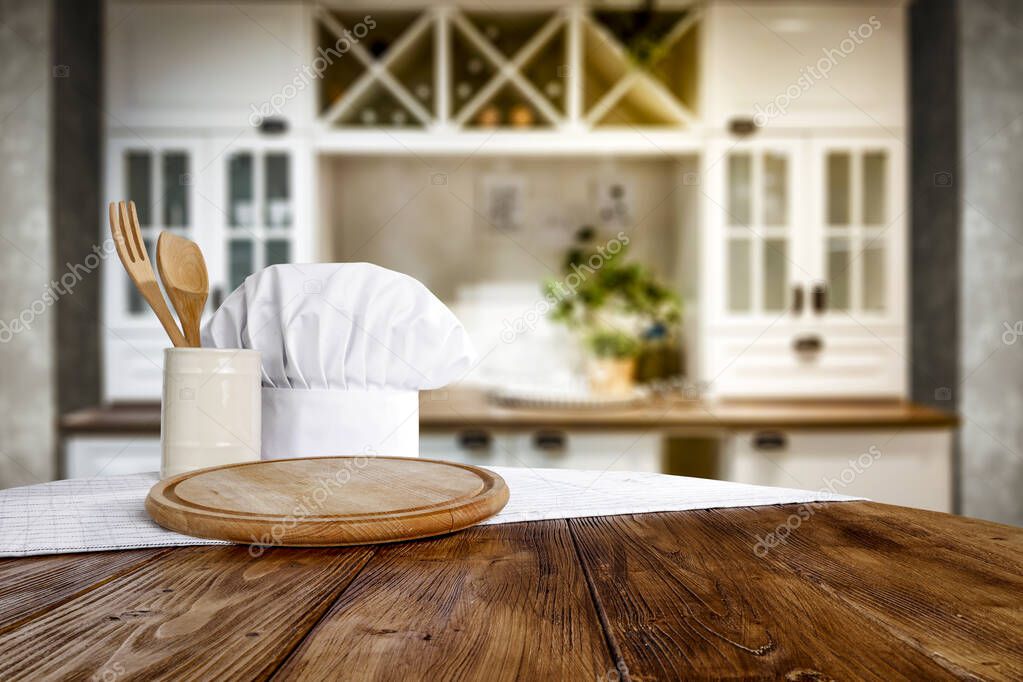 Kitchen table top with empty space for you products or decoration and blurred kitchen background.