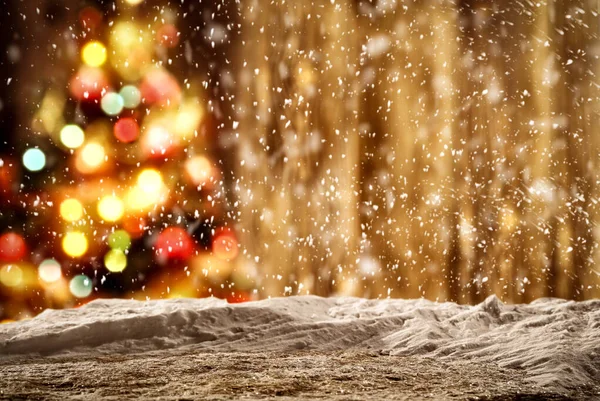 Snowy winter night background with falling snowflakes and with space for your products and decoration. Happy Christmas time.