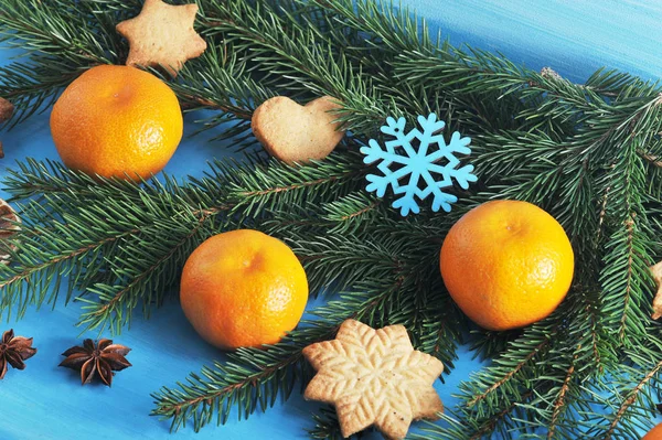 Christmas Composition Blue Wooden Background Fur Tree Branch Decorated Tangerines — Stock Photo, Image