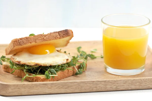 Toast Fried Egg Sprouts Peas Wooden Tray Close Glass Orange — Stock Photo, Image