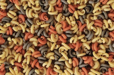 Bukleler şeklinde çok renkli makarna arka plan. Close.