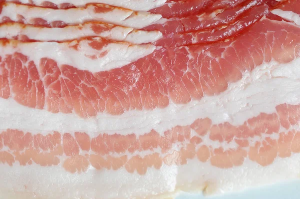 Bacon slices occupy the entire frame space. View from above. Macro shooting.