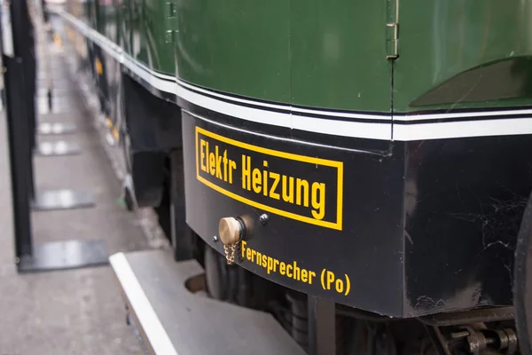 Note electric heating sign on old passenger car