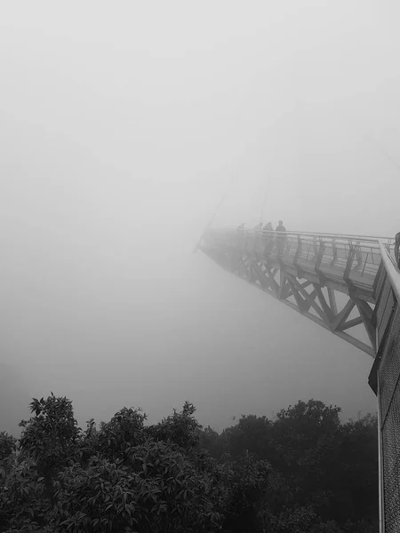Sky bridge in thick fog in Langkawi Malaysia black and white
