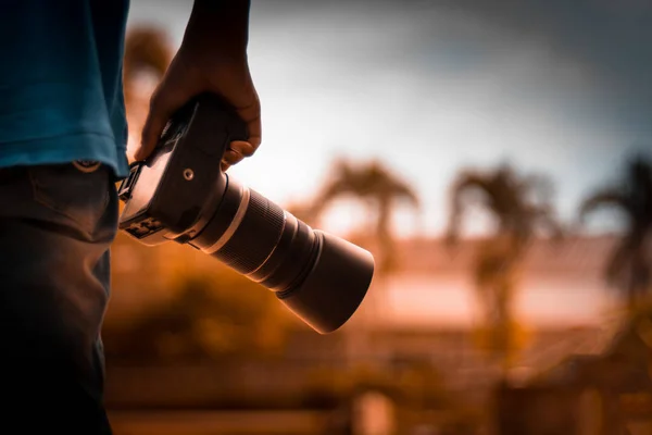 Professional photographers are walking to take natural pictures. Soft focus when evening sun light