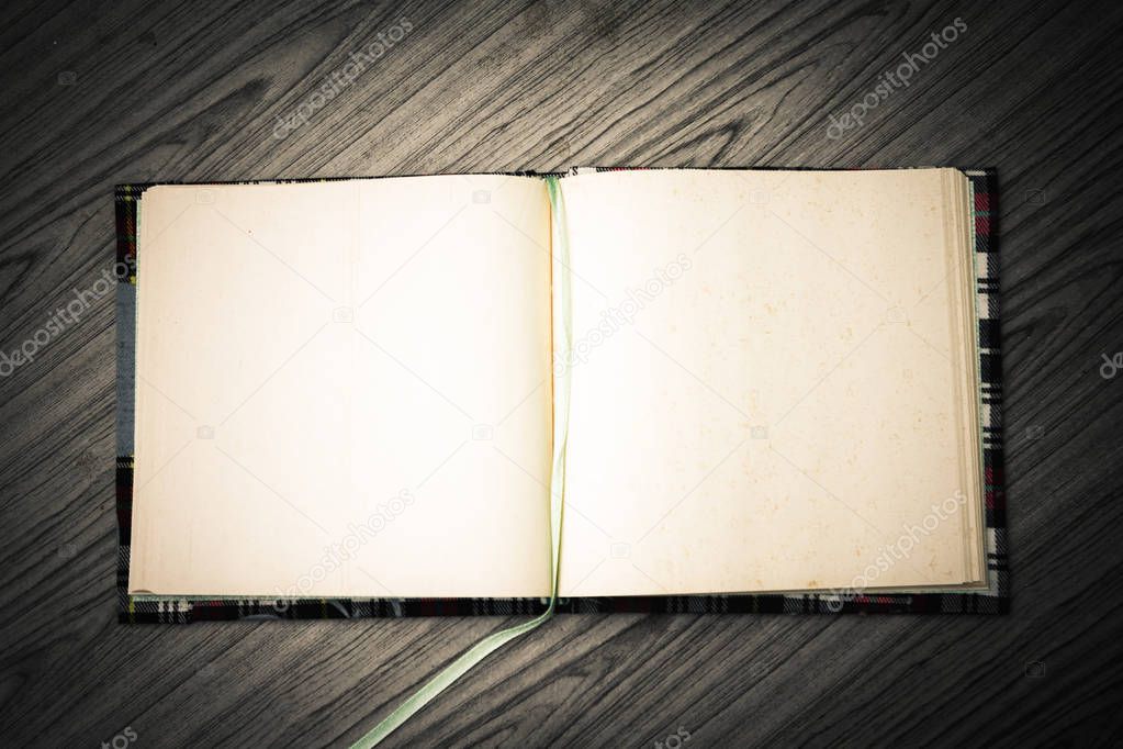 Open notebook on wooden desk .Blank notebook