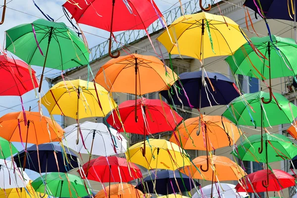 multi-colored umbrellas during a holiday on the street