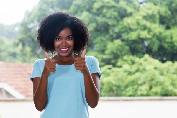 Cute African American Woman Showing Both Thumbs Outdoors — Stock Photo, Image