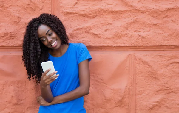 Beautiful African American Woman Blue Shirt Texting Message Mobile Phone — Stock Photo, Image