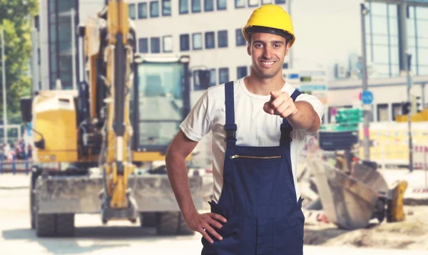 Yellow Earthmover Pointing Latin American Construction Worker Construction Site — Stock Photo, Image