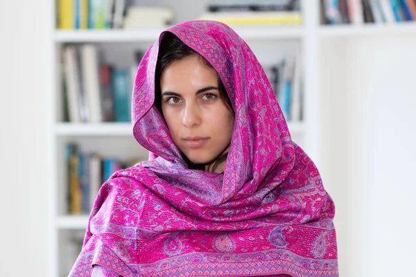 Beautiful indian woman with scarf indoor at home