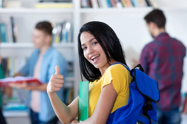 Successful Mexican Female Student Showing Thumb Library University — Φωτογραφία Αρχείου