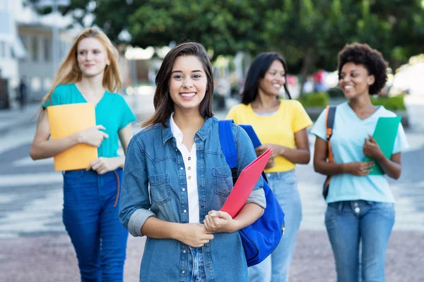 Young spanish female student with group of women — Stock Photo, Image