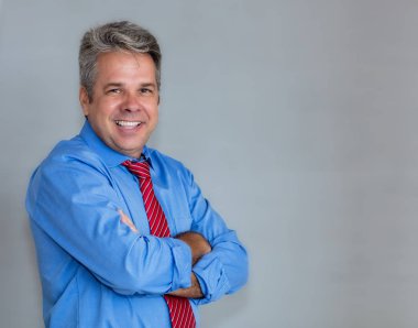 Lauhing mature businessman with grey hair